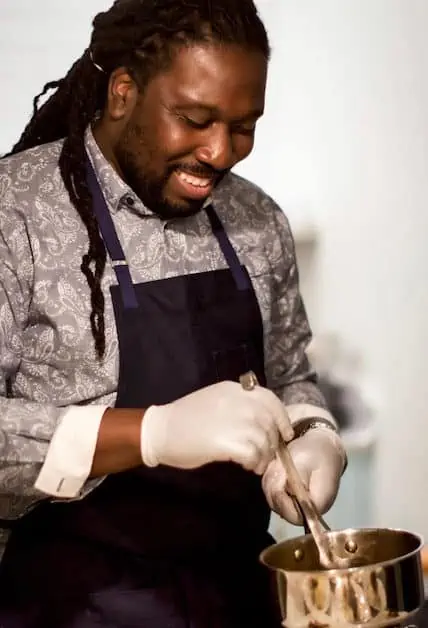 Chef Leighton from Aroma Culinary mixes sauce for one of his infused summer recipes, like the tasty CBD BBQ Wings