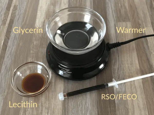 A small mug or candle warmer is shown to gently heat the RSO or FECO with glycerin before infusing it into the gummy bears.