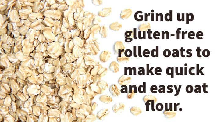 Rolled Oats spread out on a white background ready to make into oat flour.