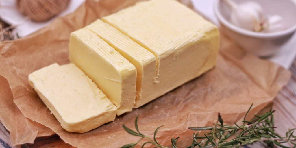 A stick of butter sits on the table being prepared for infusion into Cannabutter