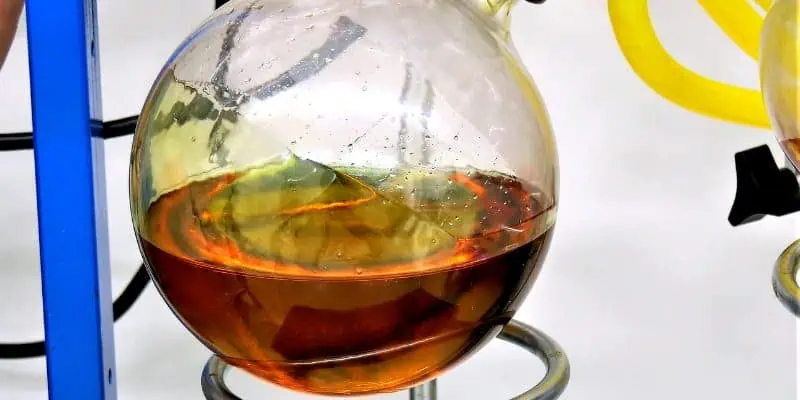 This image shows cannabis oil concentrate in a sphere like glass container as it spins while the material is tested for potency and other variables.