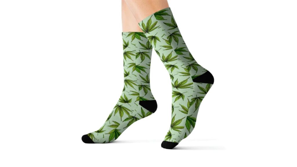 Part of every cannabis buyer's guide, this photo features the best-seller green cannabis leaf socks.