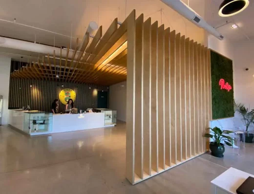 The lobby of a modern office in Santa Rosa features a wooden wall.