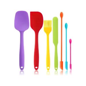 A set of colorful kitchen utensils on a white background.