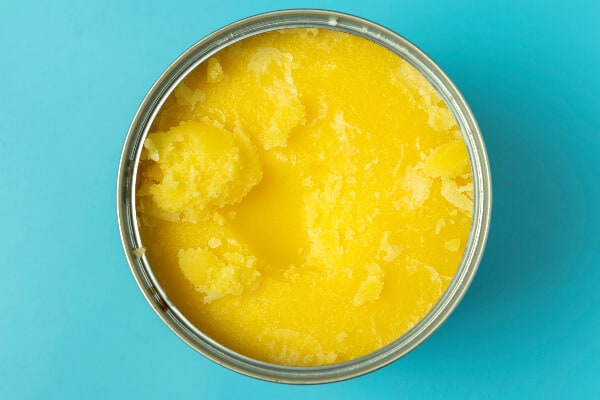 Pan of yellow clarified butter ready to infuse into cannabis butter.