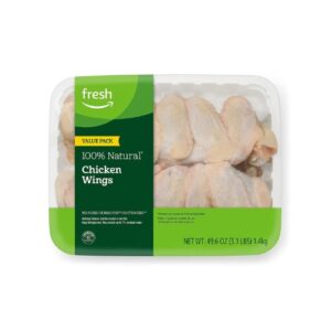 Fresh chicken wings in a plastic container.