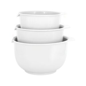 Three white mixing bowls stacked on top of each other.