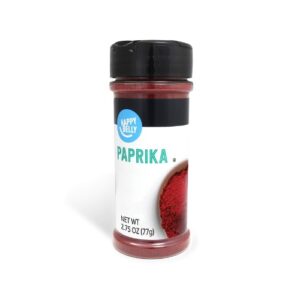 Paprika powder in a bottle on a white background.