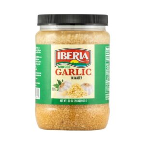 A jar of garlic on a white background.