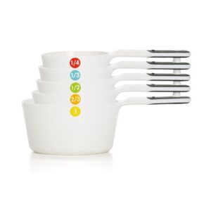 A set of measuring cups with different colors on them.