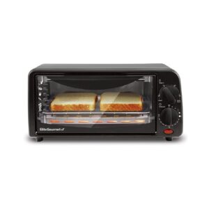 A toaster oven with two slices of bread in it.