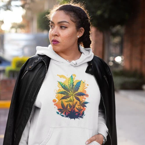 A woman wearing a dope hoodie with marijuana leaves on it, representing a warm cannabis paradise