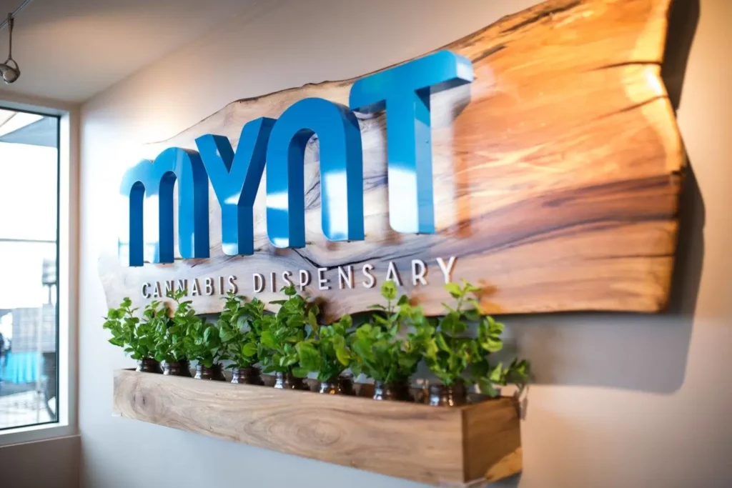 MYNT Cannabis Dispensary wood sign on 2nd Street in Reno, Nevada.