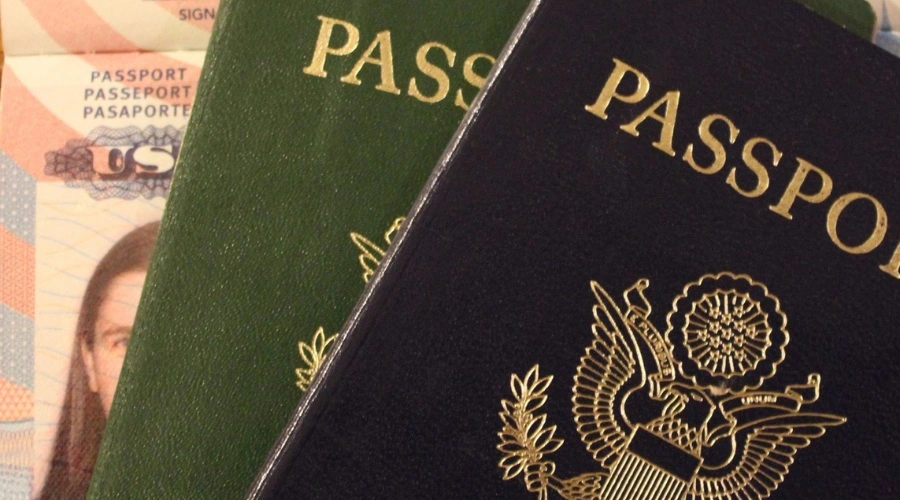 A picture of two passports are displayed in reference to the documents needed to complete your medical marijuana application in Illinois