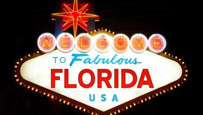 A sign reads, welcome to the fabulous Florida USA, illustrating the eligibility criteria for a Florida Medical Cannabis Card