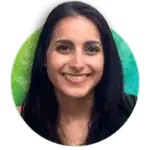 A woman with long, straight dark hair smiles at the camera. She is in front of a green and blue gradient background and is wearing a sleeveless top. The image is cropped in a circular frame.