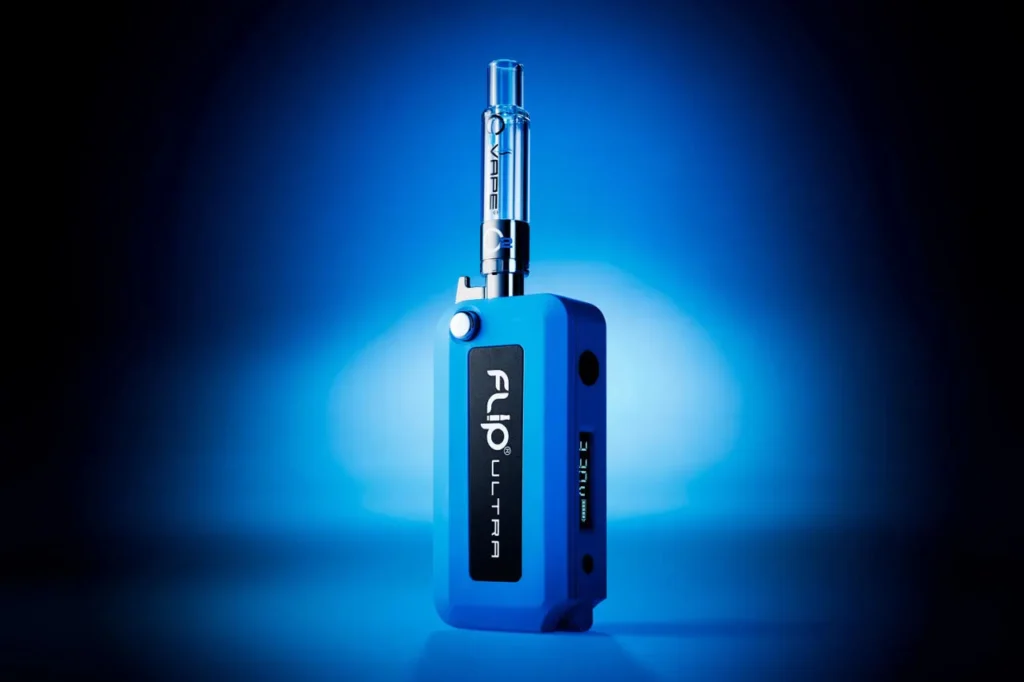 A blue Flip Ultra vape battery device from O2VAPE stands upright against a vibrant blue gradient background, with a clear cartridge attached and the brand name